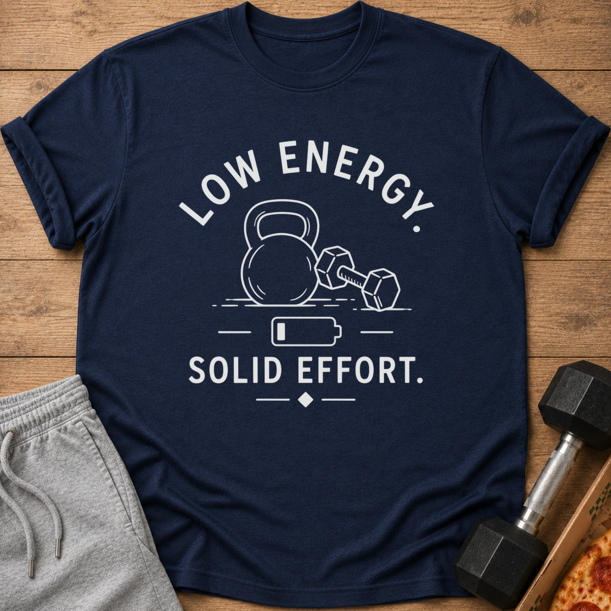 Navy t-shirt with white text and graphics of a kettlebell, dumbbell, and battery.