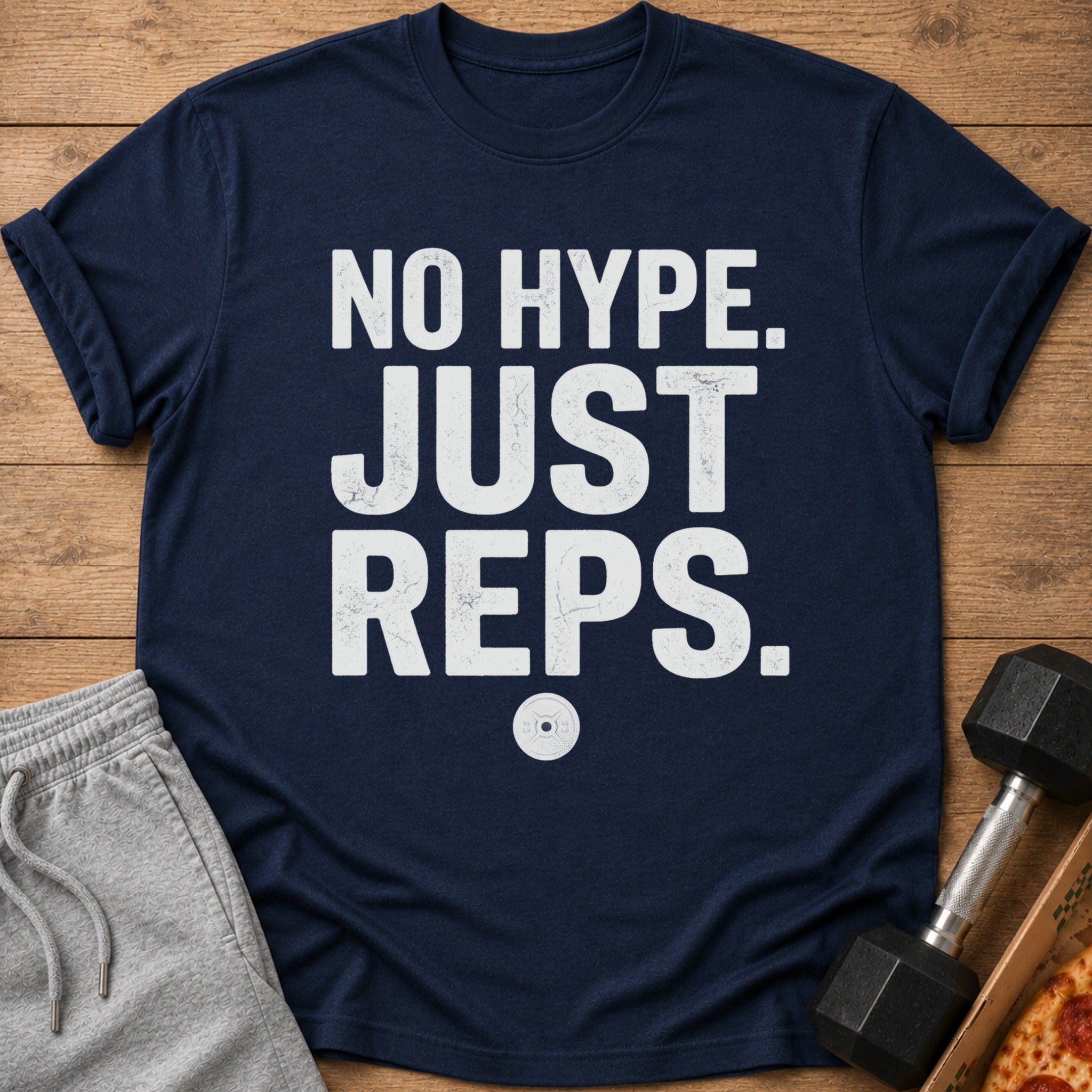 Navy t-shirt with white distressed text "NO HYPE. JUST REPS." and a weight plate graphic.