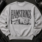 Gray sweatshirt with black text "HAMSTRINGS" and a pig doing leg curls.