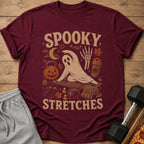 Maroon t-shirt with "Spooky Stretches" graphic featuring a ghost doing yoga and Halloween icons.