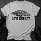 Grey t-shirt with a graphic of an alligator holding dumbbells and text "LOW ENERGY."