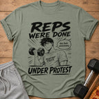 T-shirt graphic: anime man lifting dumbbell with text "REPS WERE DONE UNDER PROTEST".