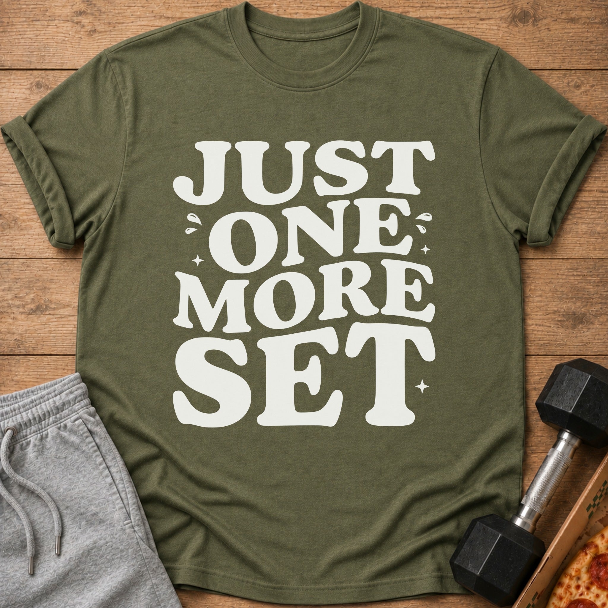 Olive green t-shirt with white text "JUST ONE MORE SET"