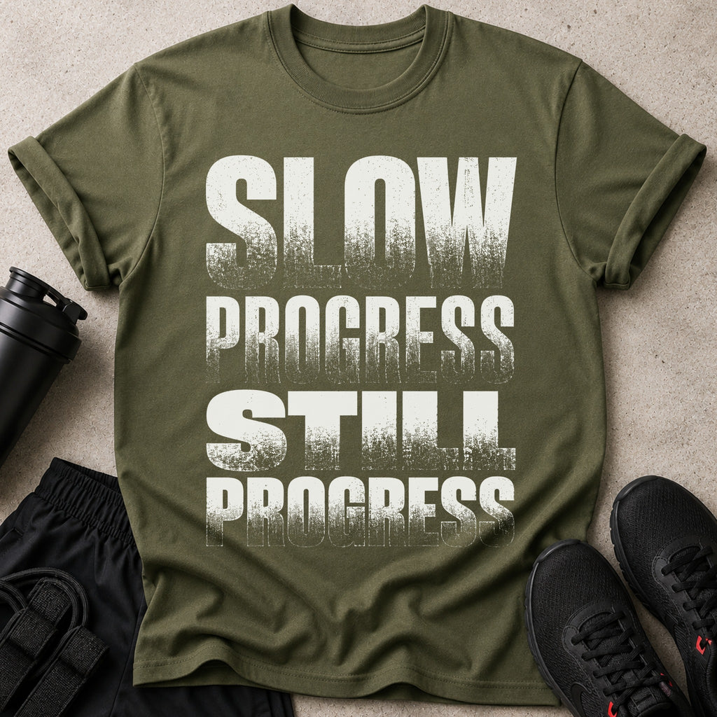 Green t-shirt with white text "SLOW PROGRESS STILL PROGRESS"