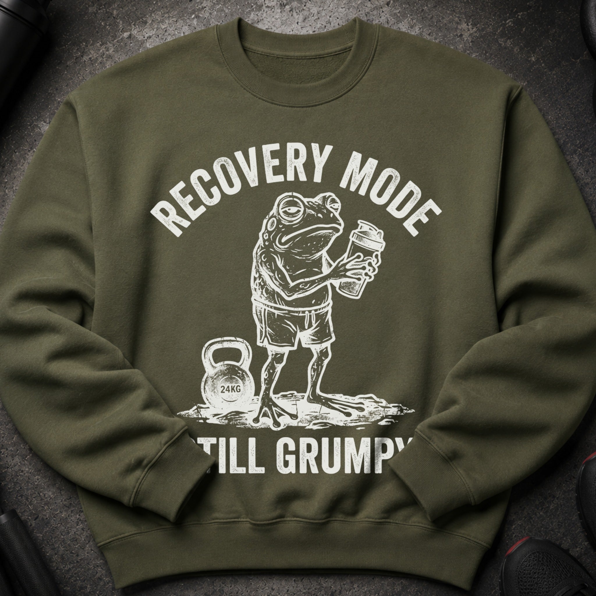Green sweatshirt with a frog holding a shaker and text "RECOVERY MODE STILL GRUMPY".