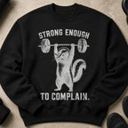 Black crewneck sweatshirt with a graphic of a chipmunk lifting a barbell and the text "STRONG ENOUGH TO COMPLAIN."