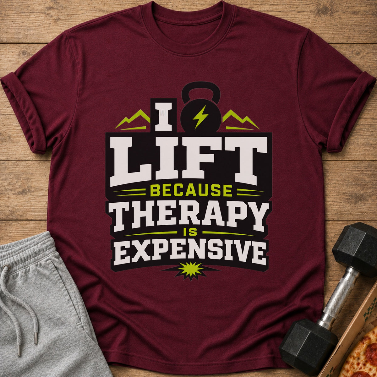 Maroon t-shirt with "I Lift Because Therapy Is Expensive" text and gym icons.