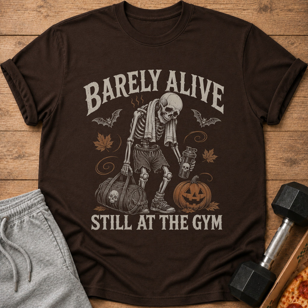 Brown t-shirt with skeleton design, text "BARELY ALIVE STILL AT THE GYM".