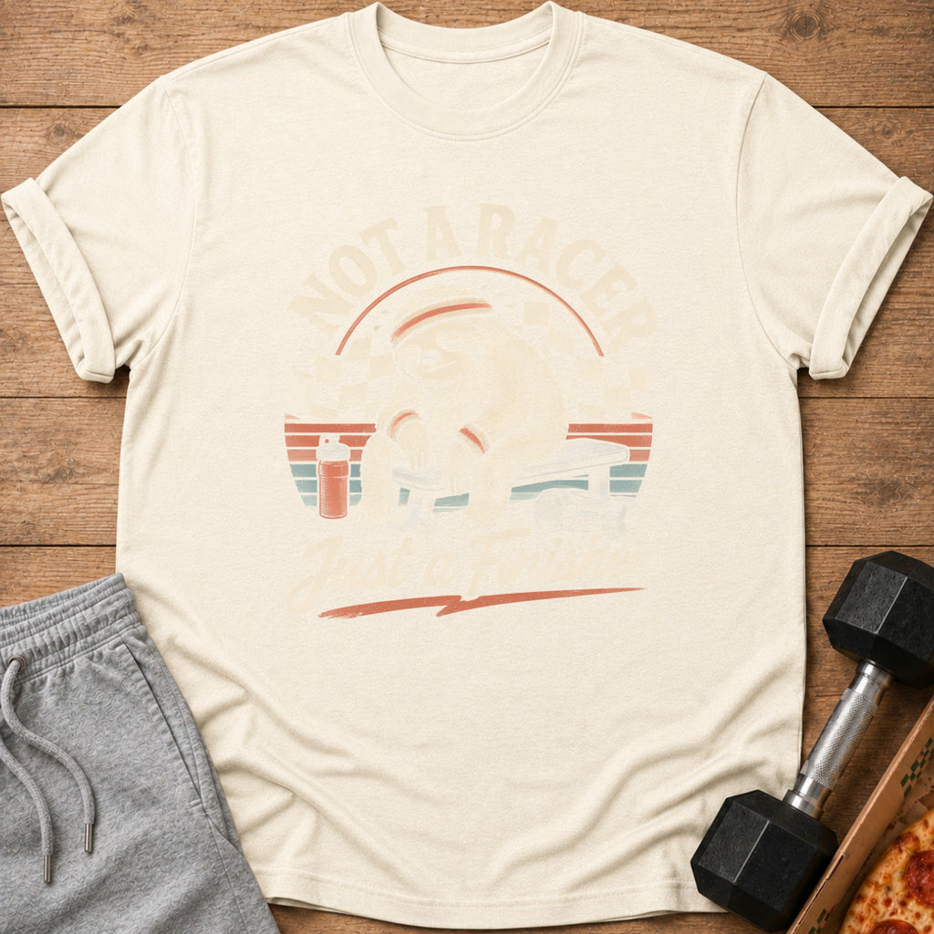 Cream t-shirt with graphic of a sloth lifting weights, text "NOT A RACER" and "JUST A FIXER".