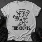Grey t-shirt with cartoon pizza lifting dumbbell and text "THIS COUNTS."