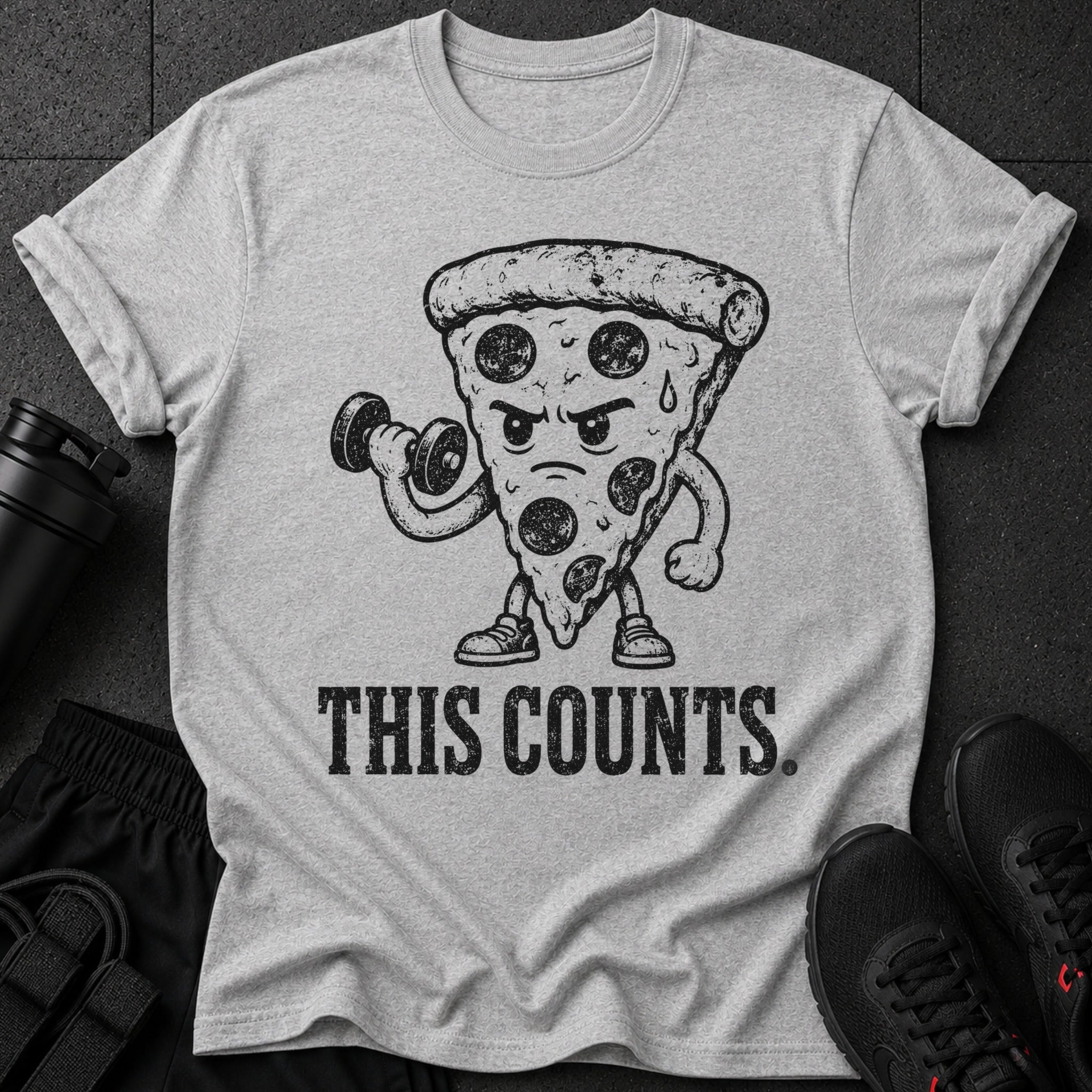 Grey t-shirt with cartoon pizza lifting dumbbell and text "THIS COUNTS."