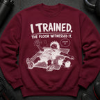 Maroon sweatshirt with "I TRAINED. THE FLOOR WITNESSED IT. COUNT IT." comic graphic.