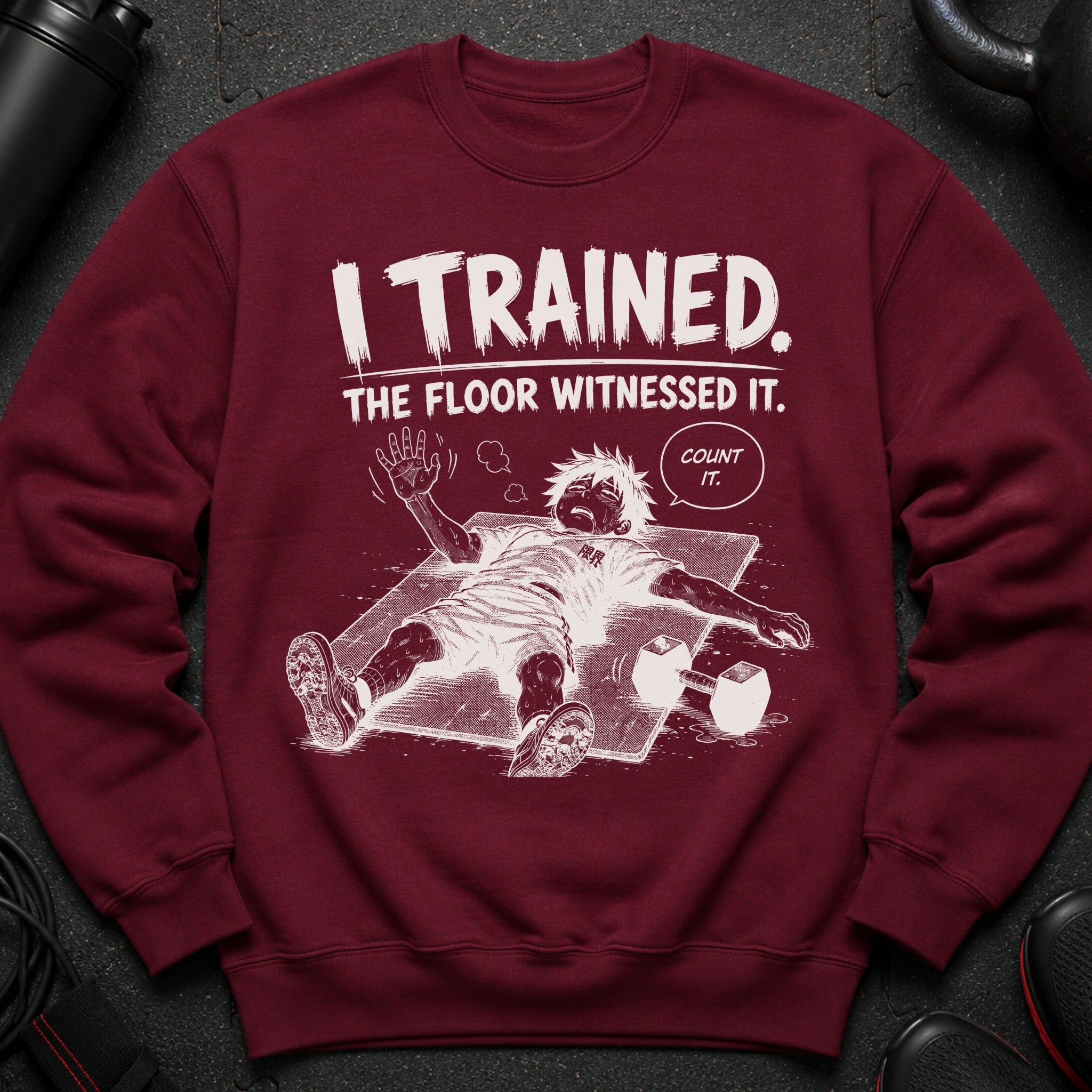 Maroon sweatshirt with "I TRAINED. THE FLOOR WITNESSED IT. COUNT IT." comic graphic.