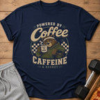 T-shirt graphic of a bear drinking coffee, saying "Powered by Coffee, Caffeine & Regret."