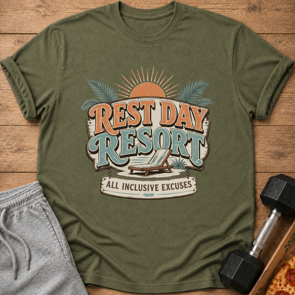 Green t-shirt with "Rest Day Resort All Inclusive Excuses" graphic and chaise lounge.