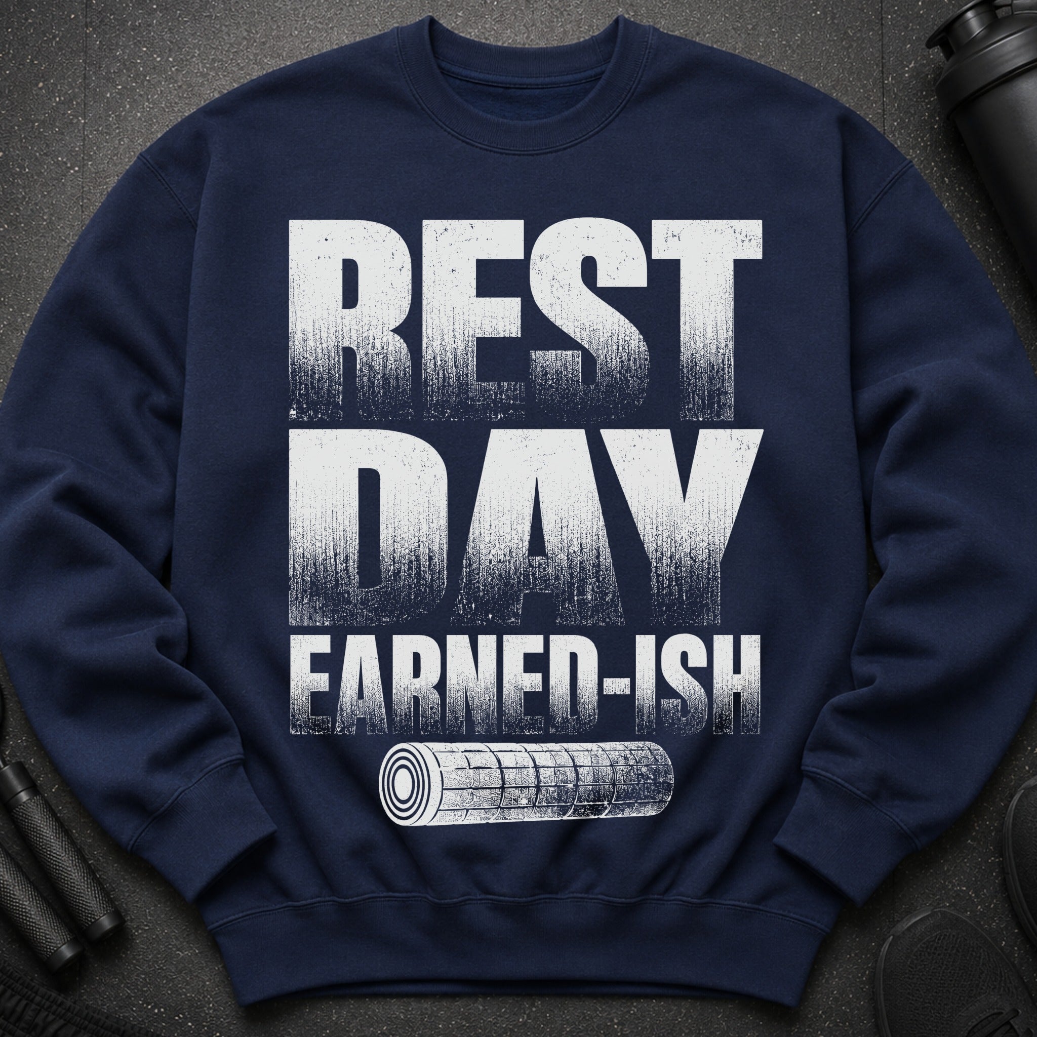 Navy sweatshirt with "REST DAY EARNED-ISH" text and white gym roller graphic.