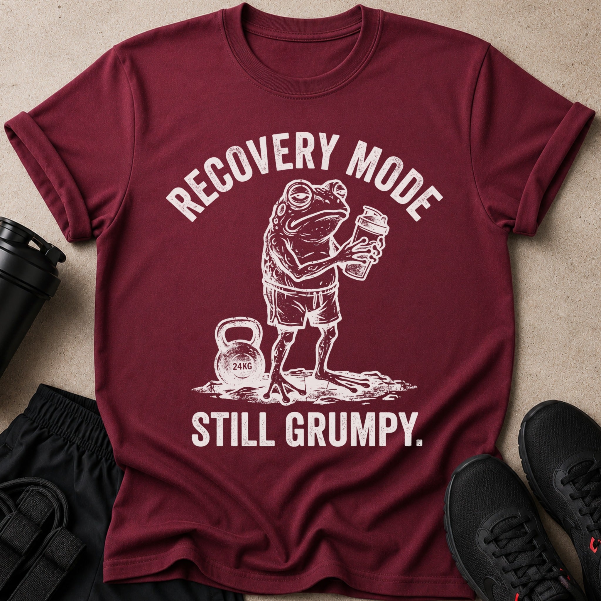 Maroon t-shirt with distressed graphic of a frog holding a shaker, "RECOVERY MODE STILL GRUMPY."