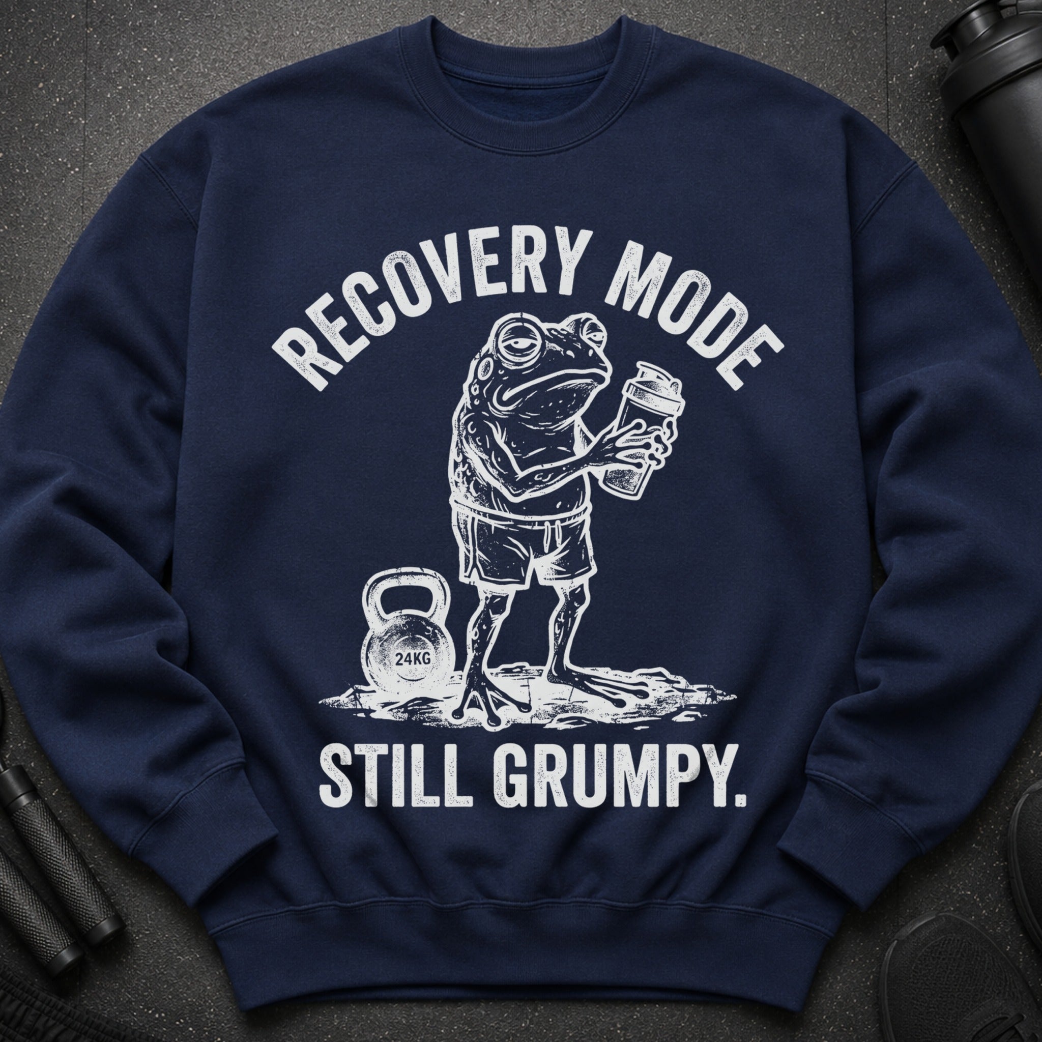 Navy sweatshirt with white graphic of a grumpy frog holding a drink, kettlebell and text.