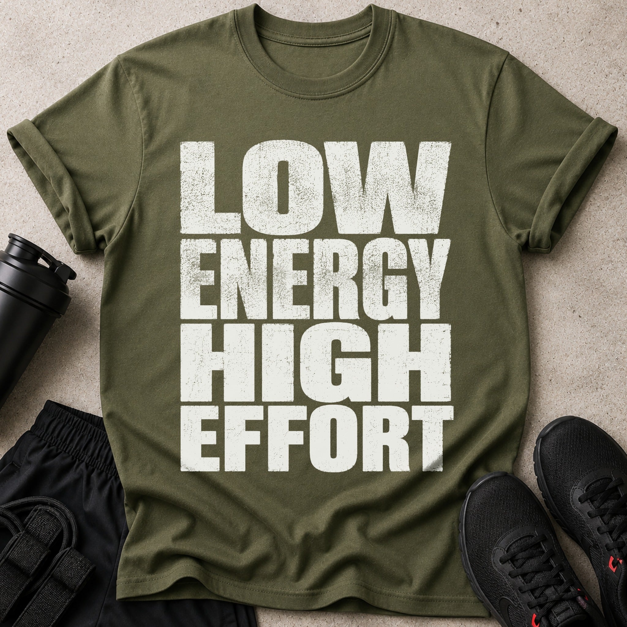 Olive t-shirt with distressed white text "LOW ENERGY HIGH EFFORT".