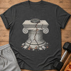 T-shirt featuring a cracked stone pillar with a weight plate and sparks.