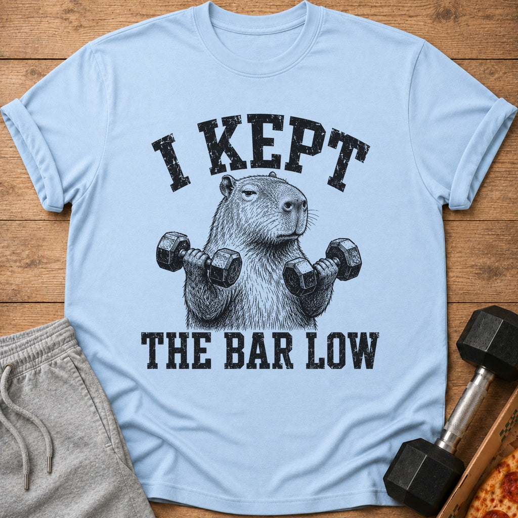 Light blue t-shirt with distressed graphic of capybara lifting dumbbells and text.