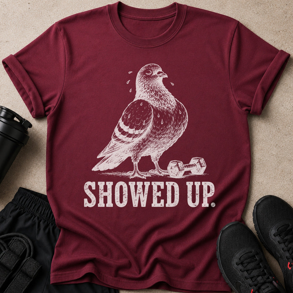 Maroon t-shirt with distressed graphic of a sweating pigeon and dumbbells, text "SHOWED UP."