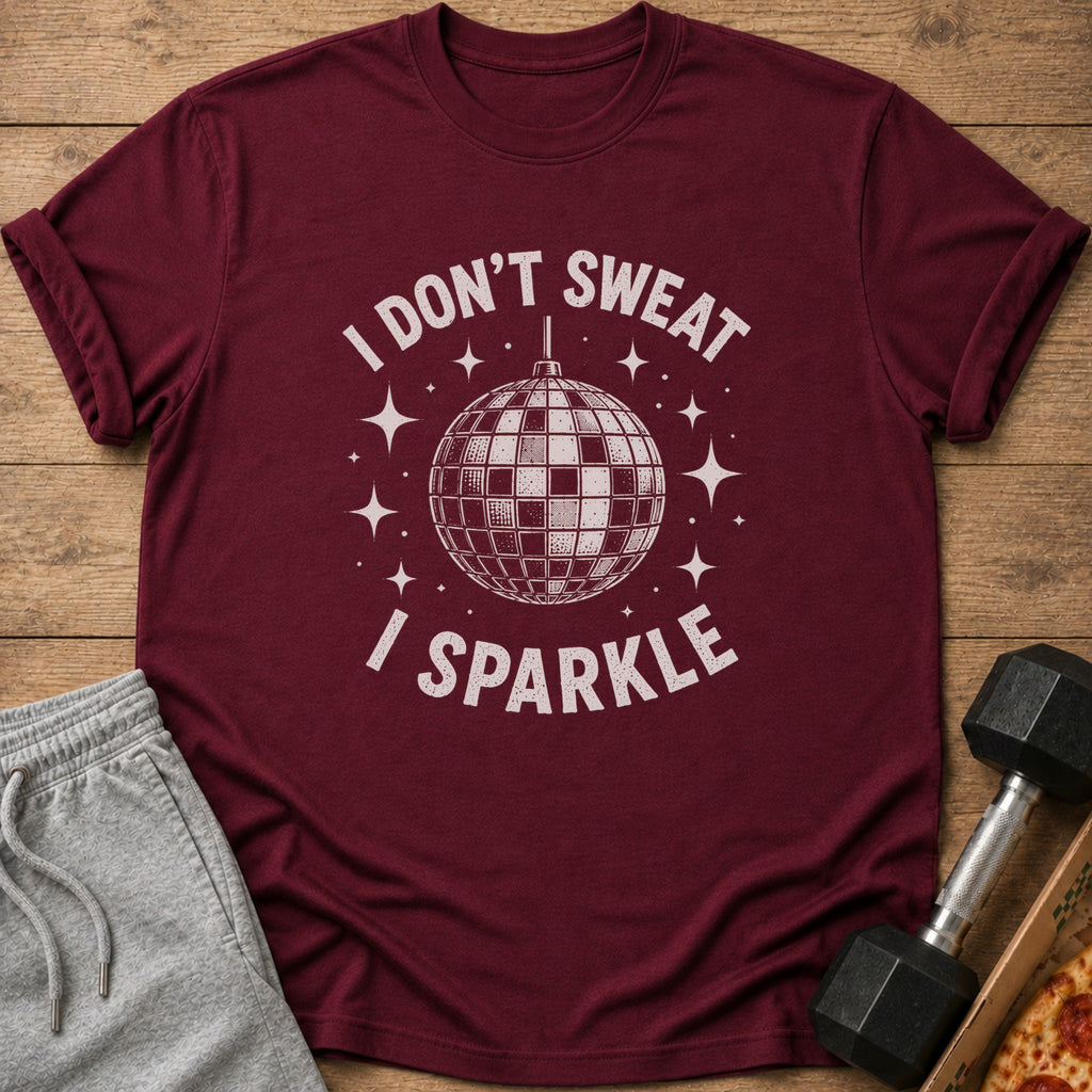 Maroon t-shirt with "I DON'T SWEAT I SPARKLE" and disco ball graphic.