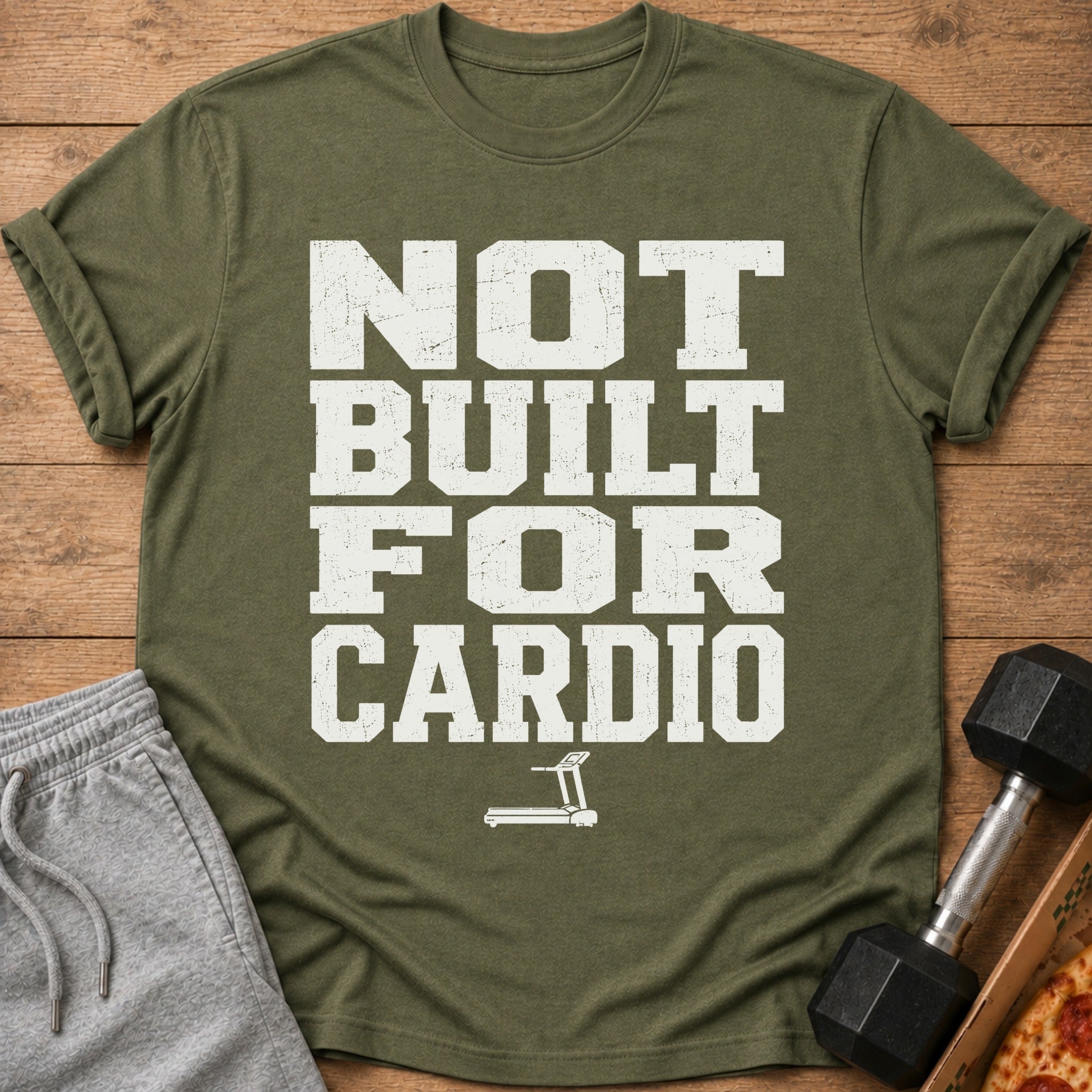 Olive green t-shirt with "NOT BUILT FOR CARDIO" and treadmill graphic.