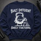 Navy sweatshirt with cartoon kettlebell and shaker, text "BUILT DIFFERENT BARELY FUNCTIONING."