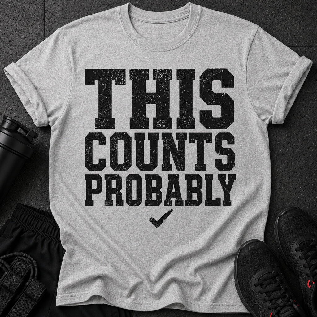 Grey t-shirt with distressed black text "THIS COUNTS PROBABLY" and a checkmark.