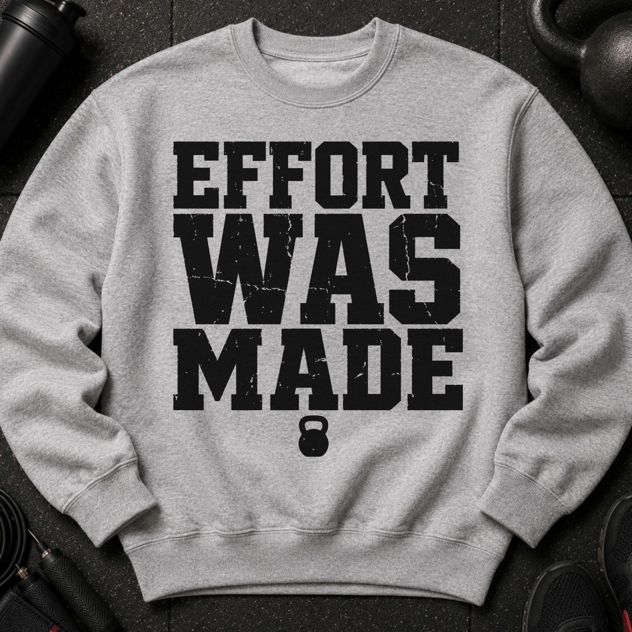 Grey sweatshirt with black text "EFFORT WAS MADE" and a kettlebell.