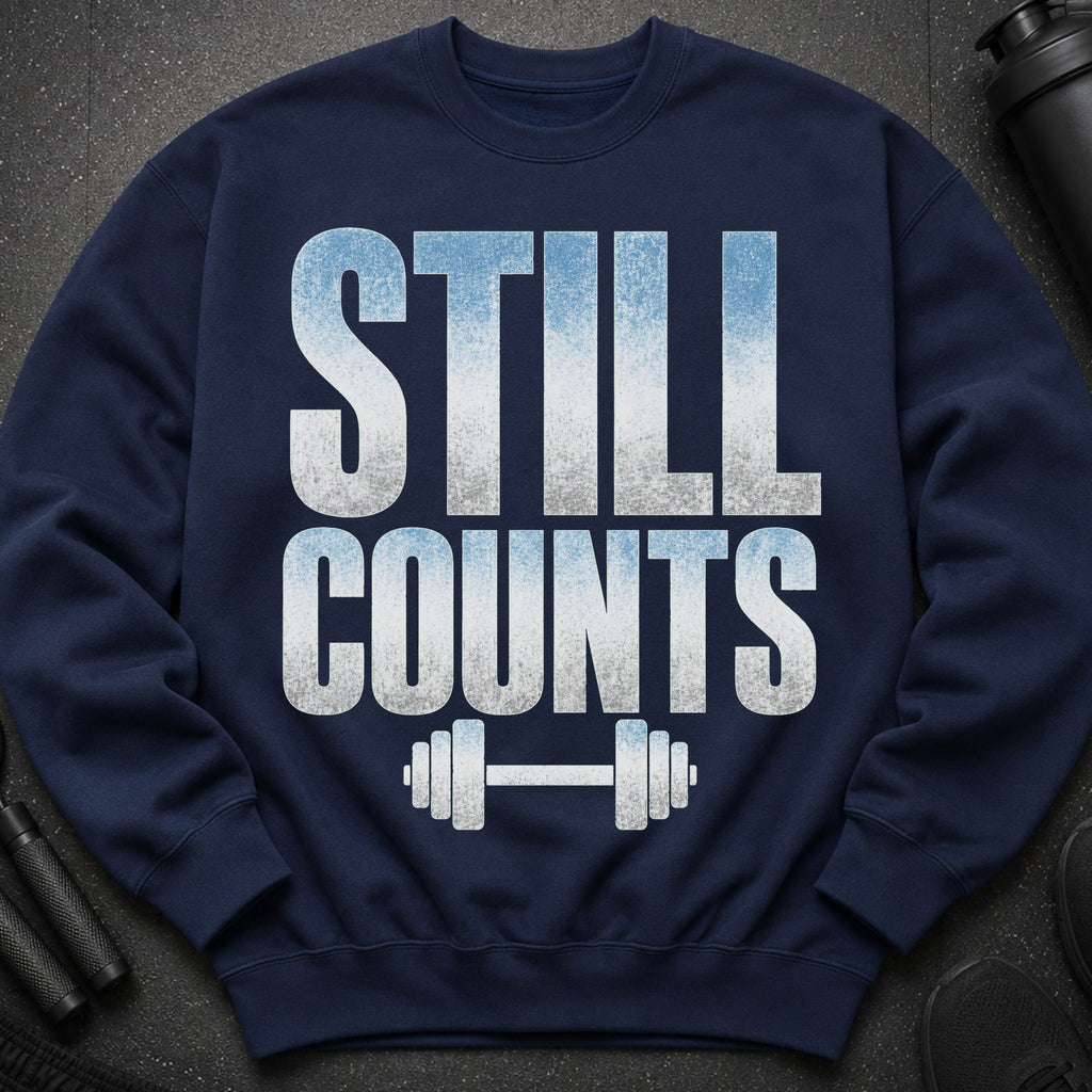 Navy sweatshirt with "STILL COUNTS" text and a dumbbell graphic.