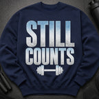 Navy sweatshirt with "STILL COUNTS" text and a dumbbell graphic.