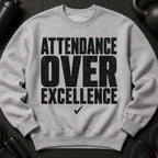Grey sweatshirt with black text that reads "ATTENDANCE OVER EXCELLENCE" and a checkmark.