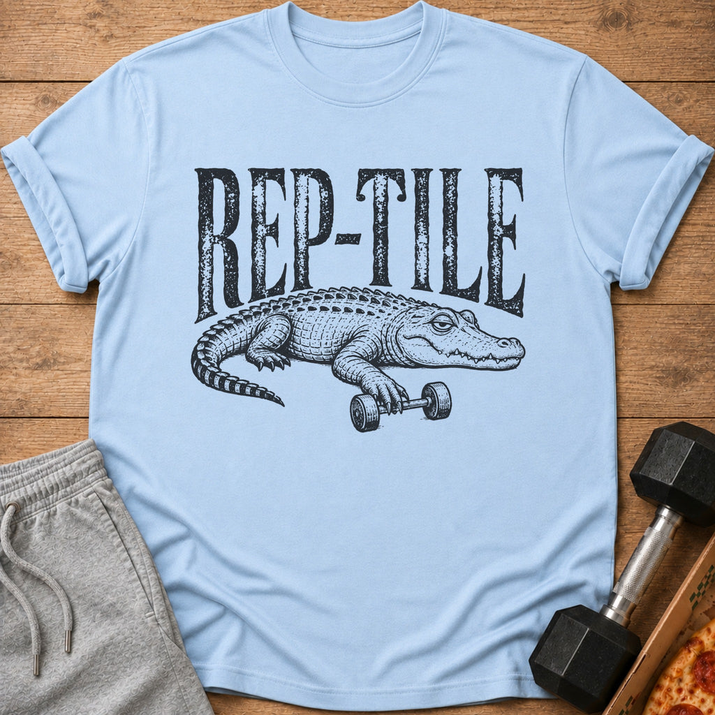 Light blue t-shirt with text "REP-TILE" above an alligator holding a dumbbell.