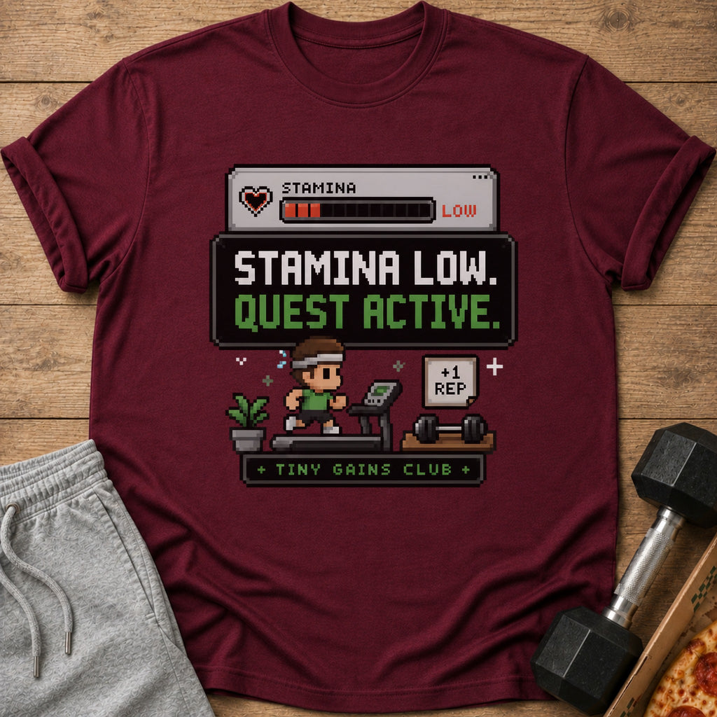 Maroon t-shirt with pixelated design: "Stamina Low. Quest Active. +1 Rep. Tiny Gains Club."