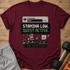 Maroon t-shirt with pixelated design: "Stamina Low. Quest Active. +1 Rep. Tiny Gains Club."