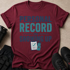 Maroon t-shirt with "Personal Record In Showing Up" text and graphic.