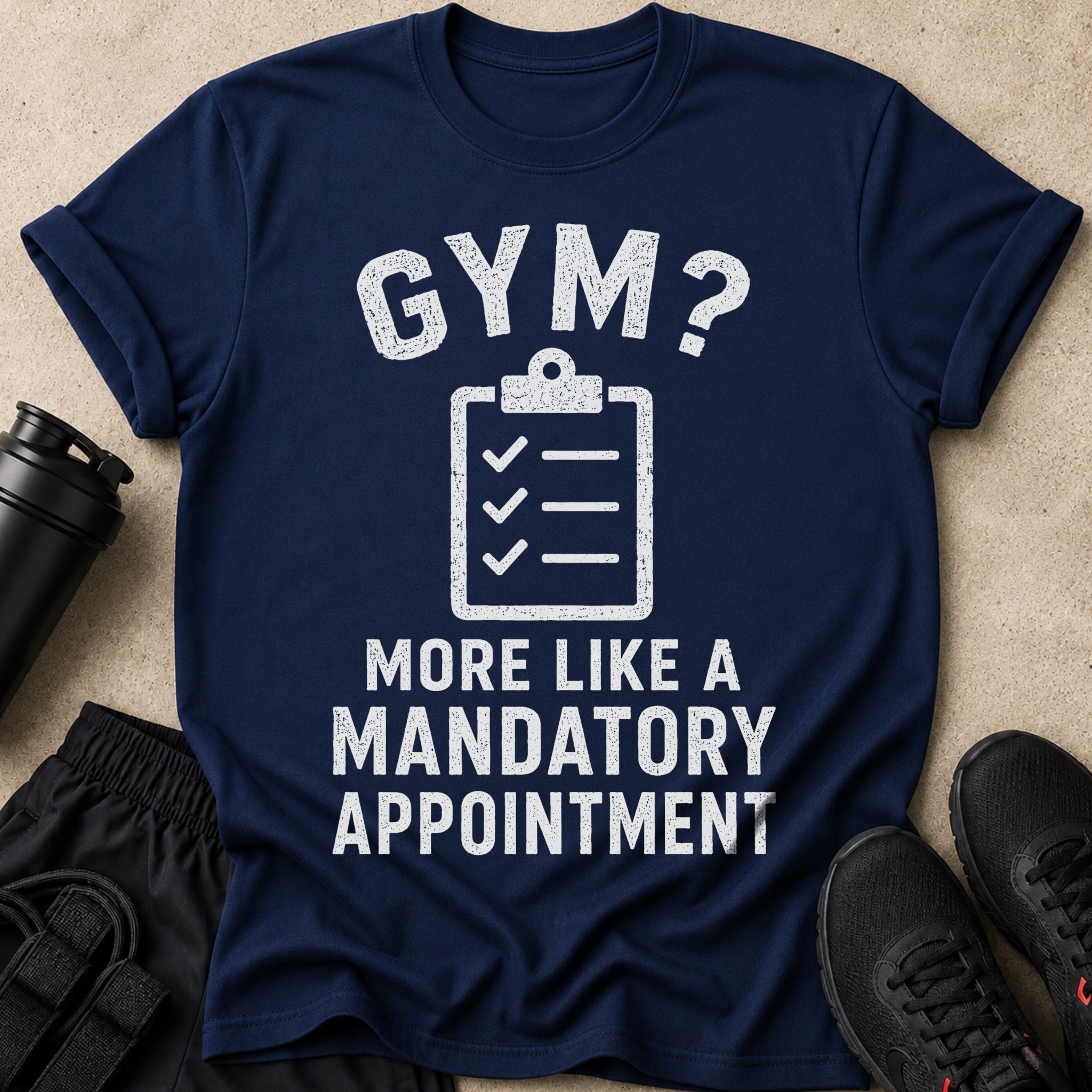Navy t-shirt with distressed white text "GYM? MORE LIKE A MANDATORY APPOINTMENT".