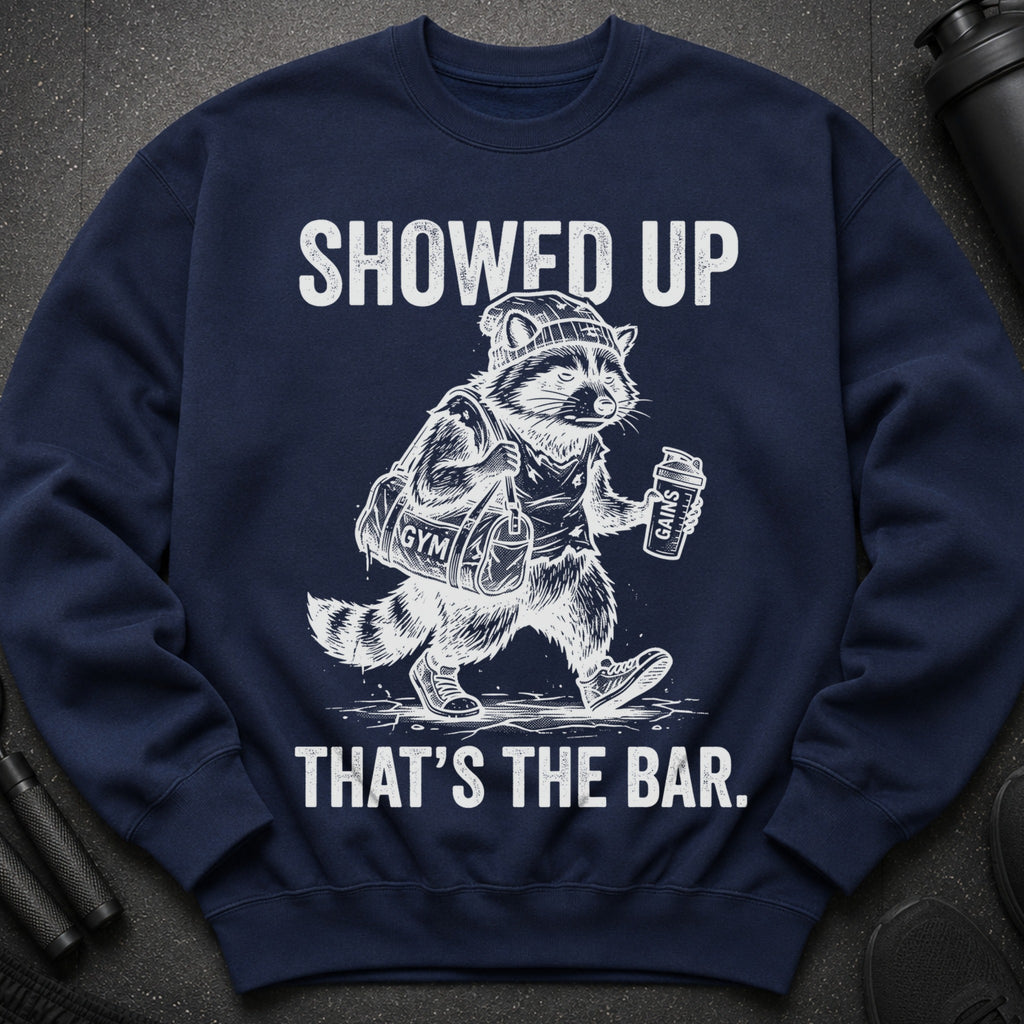 Navy sweatshirt with distressed graphic: "SHOWED UP THAT'S THE BAR."
