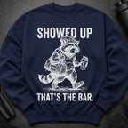 Navy sweatshirt with distressed graphic: "SHOWED UP THAT'S THE BAR."
