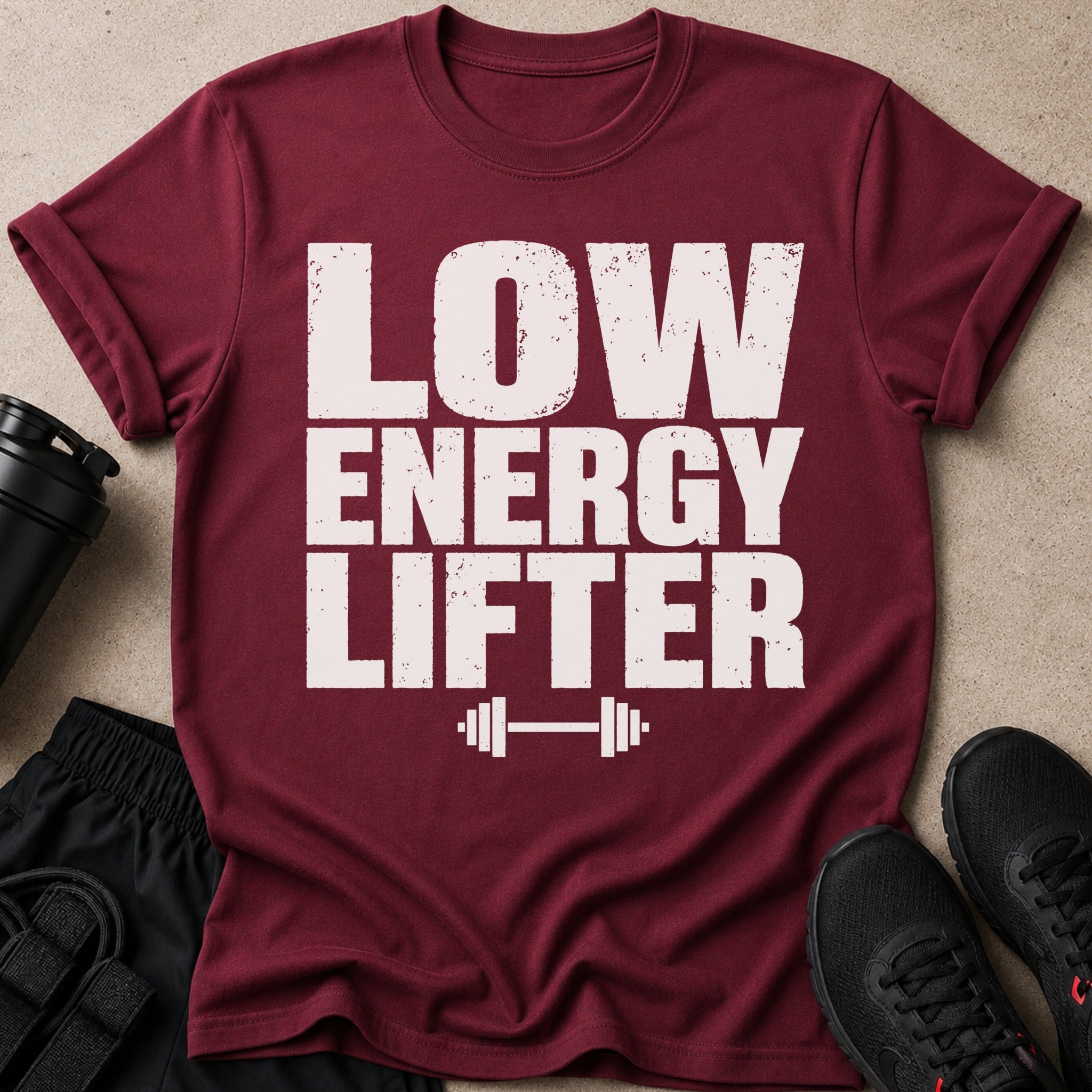 Maroon t-shirt with white distressed text "LOW ENERGY LIFTER" and dumbbell graphic.