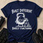 Navy t-shirt design with "BUILT DIFFERENT" and a tired kettlebell graphic.
