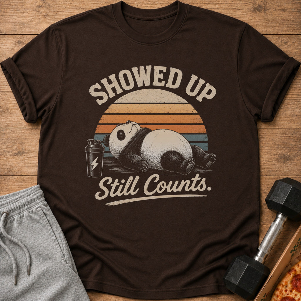 Dark brown t-shirt with panda and text: Showed Up Still Counts.