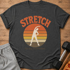 Dark t-shirt with "STRETCH Barely committed." text and stretching silhouette.