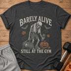 Skeleton in gym clothes holds duffel and drink, with text "Barely Alive Still at the Gym."