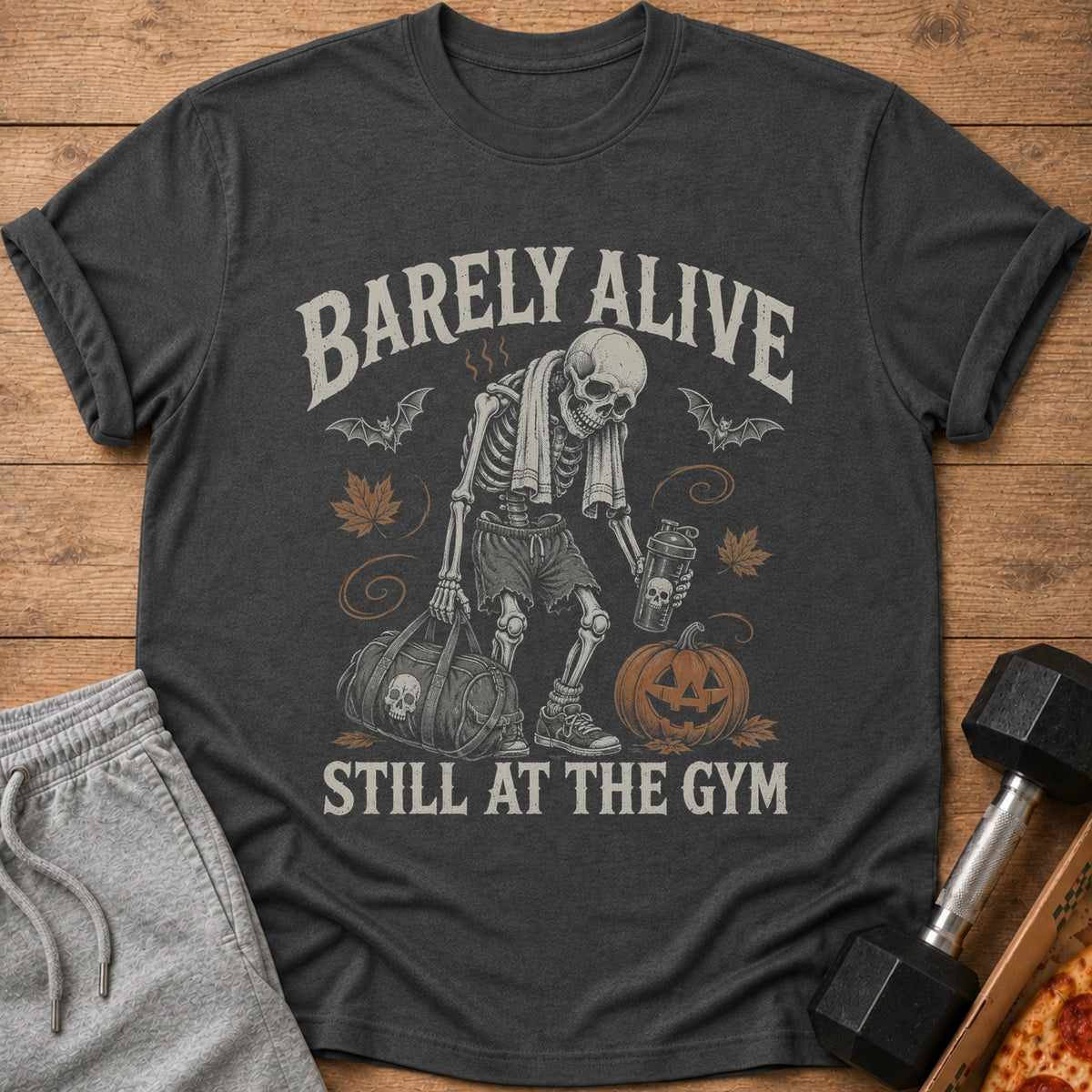 Skeleton in gym clothes holds duffel and drink, with text "Barely Alive Still at the Gym."
