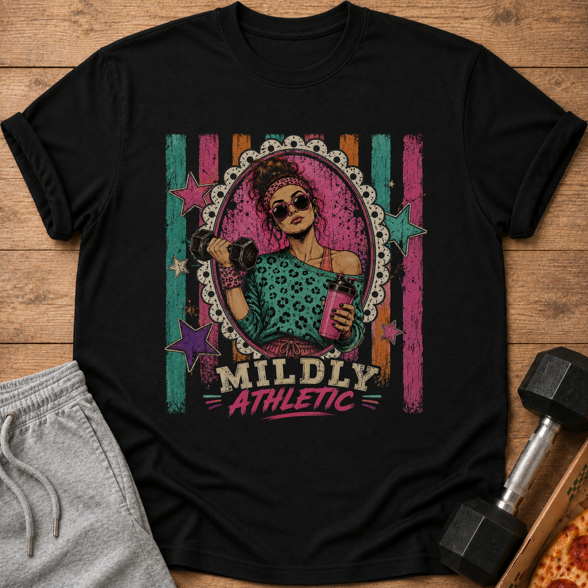 Black t-shirt with "MILDLY ATHLETIC" graphic of woman lifting weights.