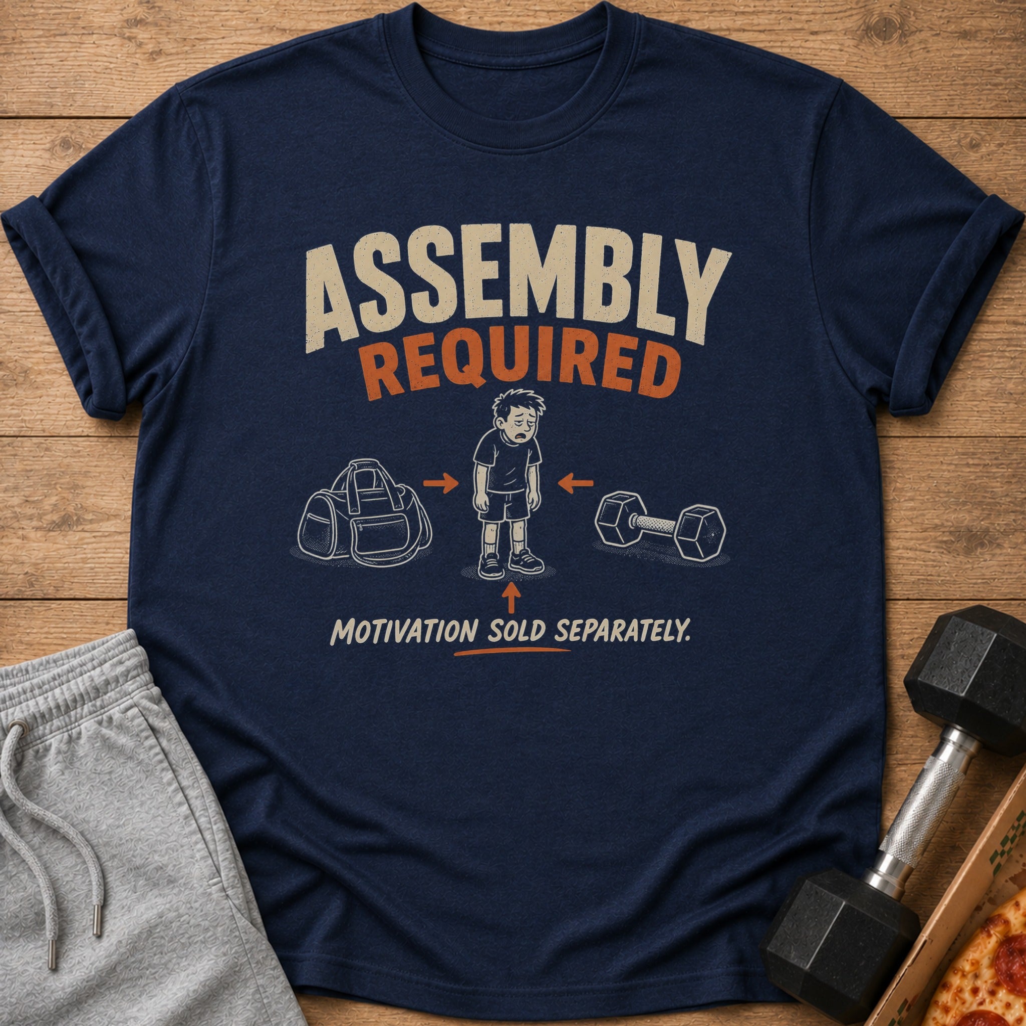 Navy t-shirt with "Assembly Required. Motivation Sold Separately." text and gym graphic.