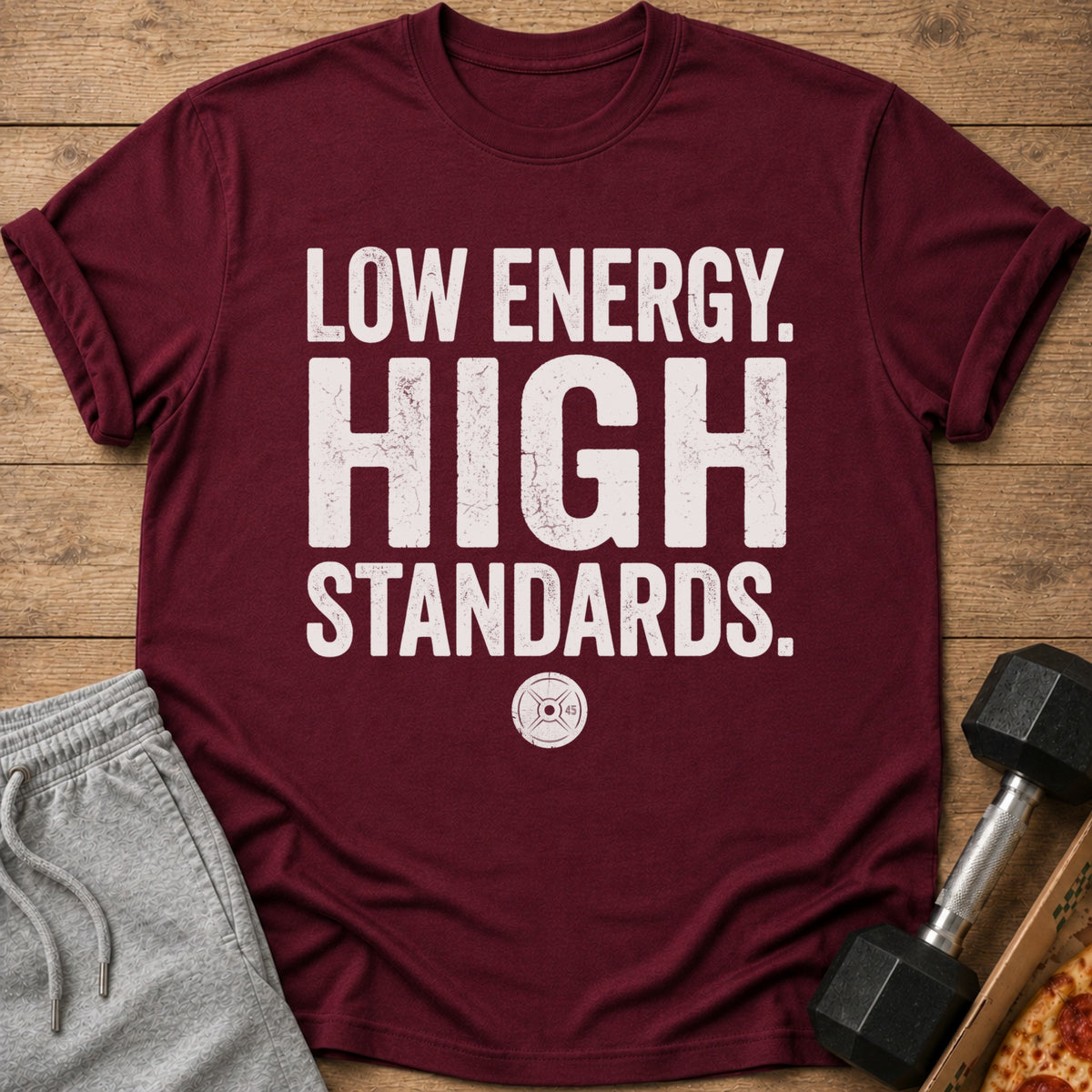 Maroon t-shirt with "LOW ENERGY. HIGH STANDARDS." text and barbell plate graphic.